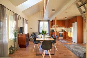 a dining room and kitchen with a table and chairs at Apartments in Porvoo in Porvoo