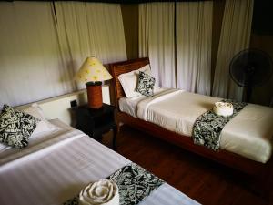 Un ou plusieurs lits dans un hébergement de l'établissement Canvas & Orchids Retreat