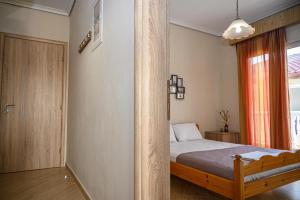 Postel nebo postele na pokoji v ubytování Anastasios Room's