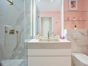 a bathroom with a sink and a shower at Maison Panthère - Luxury Harbour Residence in Saint-Tropez
