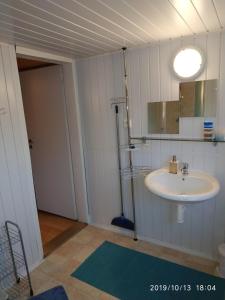 a bathroom with a sink and a mirror at Pension Panorama in Tanvald