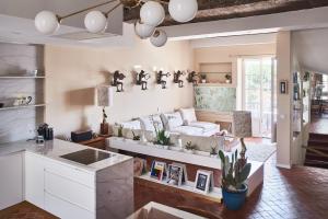 a living room with a couch and a table at Maison Panthère - Luxury Harbour Residence in Saint-Tropez +5 photos
