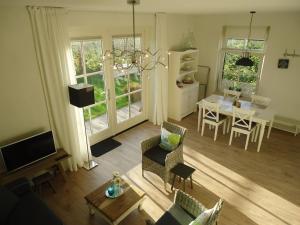 an aerial view of a living room and dining room at Ferienhaus Zeeduinsepoort in Oostkapelle