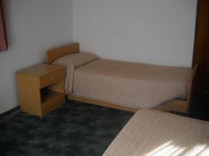 Cama o camas de una habitación en Albergo Chiara