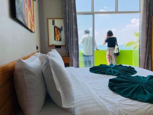 Voodi või voodid majutusasutuse IRIS Beach Residence toas