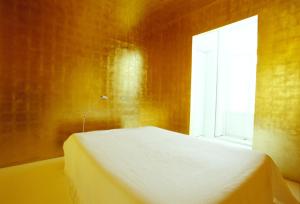 a bedroom with a white bed and a window at Le Windsor, Jungle Art Hotel in Nice