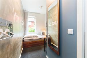 Postel nebo postele na pokoji v ubytování Smarthotel Tromsø
