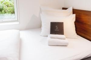 Postel nebo postele na pokoji v ubytování Smarthotel Tromsø