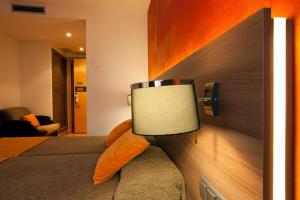 A television and/or entertainment centre at Bed and Breakfast El Pekinaire