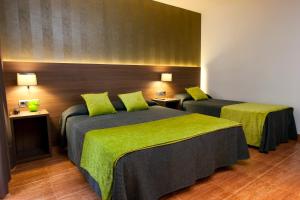 A bed or beds in a room at Bed and Breakfast El Pekinaire