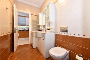 a bathroom with a toilet and a sink at İskete Suit in Istanbul