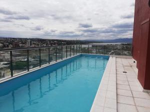 a swimming pool on the roof of a building at DEPARTAMENTO Edificio LEONARDO in Villa Carlos Paz