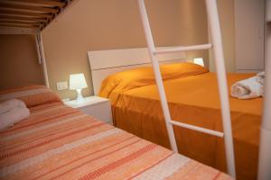 Postel nebo postele na pokoji v ubytování B&B Miramare Suite