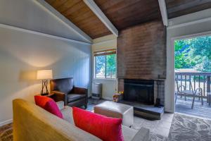 a living room with a couch and a fireplace at Big Sur Lodge in Big Sur