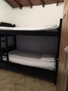 En eller flere senge i et værelse på Apartamento de Guatapé