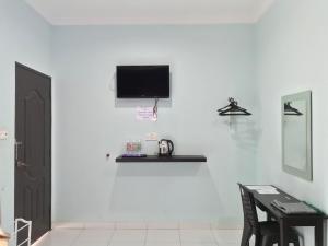 TV a/nebo společenská místnost v ubytování Changlun Chalet