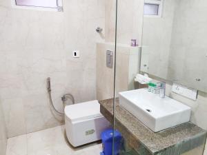 Koupelna v ubytování Bodhgaya Seven Inn Hotel n Restaurant