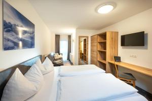 Telewizja i/lub zestaw kina domowego w obiekcie Appartements Insieme
