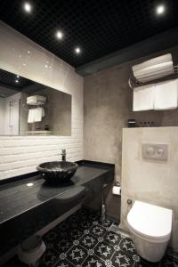 a bathroom with a sink and a toilet at Red Stone Hotel in Istanbul