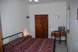 Postel nebo postele na pokoji v ubytování Casale il Colle Deruta
