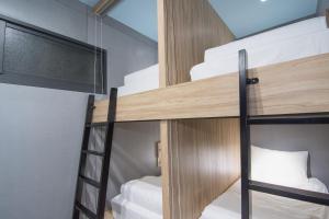Voodi või voodid majutusasutuse Liuqiu Dive Hostel toas