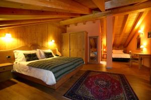 Hotel Boton D'Or & Wellness a La Thuile客房内的一张或多张床位