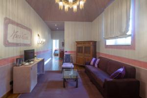 Svetainės erdvė apgyvendinimo įstaigoje Castello di Pontebosio Luxury Resort