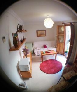 an overhead view of a living room with a couch at Escapadas romanticas en Granada jacuzzi in Granada