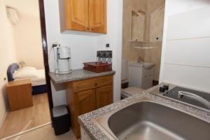 a small bathroom with a sink and a toilet at Apartments Marinko in Promajna +56 photos