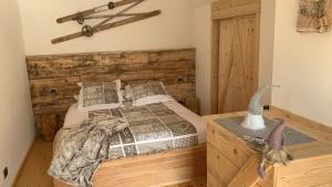 A bed or beds in a room at Al bosco incantato