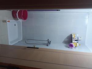 a kitchen counter with a sink and a faucet at Relaxation apartment in Marrakesh