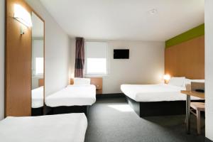 Postel nebo postele na pokoji v ubytování B&B HOTEL Lyon Sud États-Unis