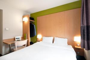 Postel nebo postele na pokoji v ubytování B&B HOTEL Lyon Sud États-Unis