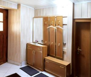 a bathroom with a sink and a mirror at Haus Talruhe in Kurort Altenberg