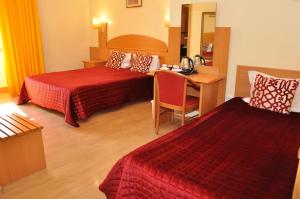 Cama ou camas em um quarto em Hotel Solneve