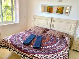 a bed with two blue towels on top of it at Villa Panorama Mijas Pueblo in Mijas +25 photos