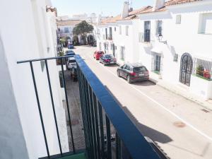 a view of a street with cars parked on the street at Conilplus Duplex RIO ROCHE in Conil de la Frontera