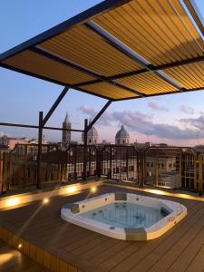 a hot tub on the roof of a building at Hotel Genova in Rome