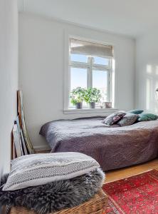 Ένα ή περισσότερα κρεβάτια σε δωμάτιο στο rækkehus ved amagerstrand