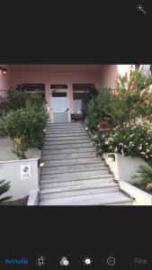 a set of stairs in front of a building at Hotel La Conchiglia in La Maddalena