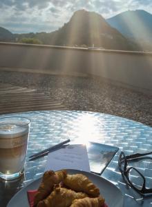 
a plate of food sitting on a table next to a body of water at Best Western Plus Amedia Art Salzburg in Salzburg
