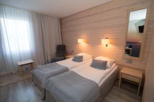 Postel nebo postele na pokoji v ubytování Hotel Ivalo