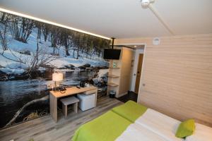 Postel nebo postele na pokoji v ubytování Hotel Ivalo