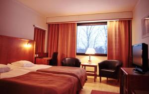 Postel nebo postele na pokoji v ubytování Hotel Ivalo