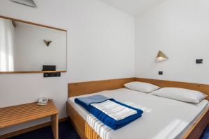 Postel nebo postele na pokoji v ubytování the Loža - seaside festival hotel + 28 fotografií