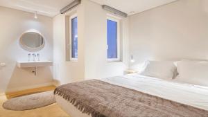 En eller flere senge i et værelse på Cozy Lisbon Alfama