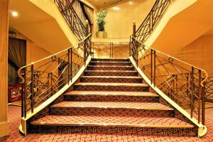 a staircase in a building with a stair case at Jaz Crown Jubilee Nile Cruise - Every Saturday from Luxor for 07 & 04 Nights - Every Wednesday From Aswan for 03 Nights in Luxor
