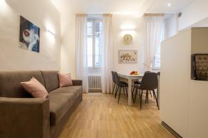 a living room with a couch and a table at Bargello Modern in Florence