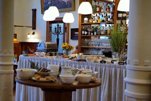 a buffet with food on a table in a restaurant at Aparthotel Am Meer in Cuxhaven