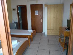 A bed or beds in a room at Haus Pigadi